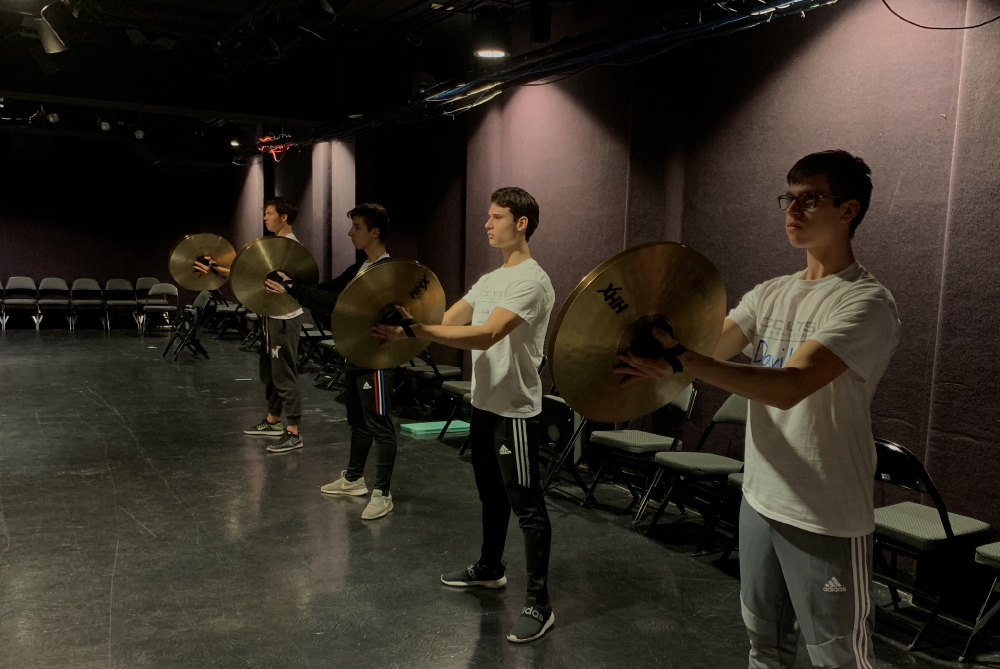 Colts cymbal players rehearsing