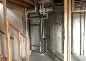 New furnace and an open spot for the water heater. Both of these will be enclosed in a closet with a sliding pocket door.